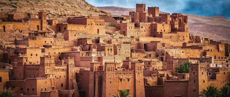 Kasbah Ait Ben Haddou rising above a palm valley in southern Morocco
